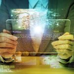 What Top Executives Predict for Media’s Future in 2025 Person holding transparent tablet displaying digital news content