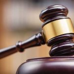 Could Ulbricht’s Pardon Reshape Justice and Cryptocurrency’s Future? Gavel striking block in courtroom setting