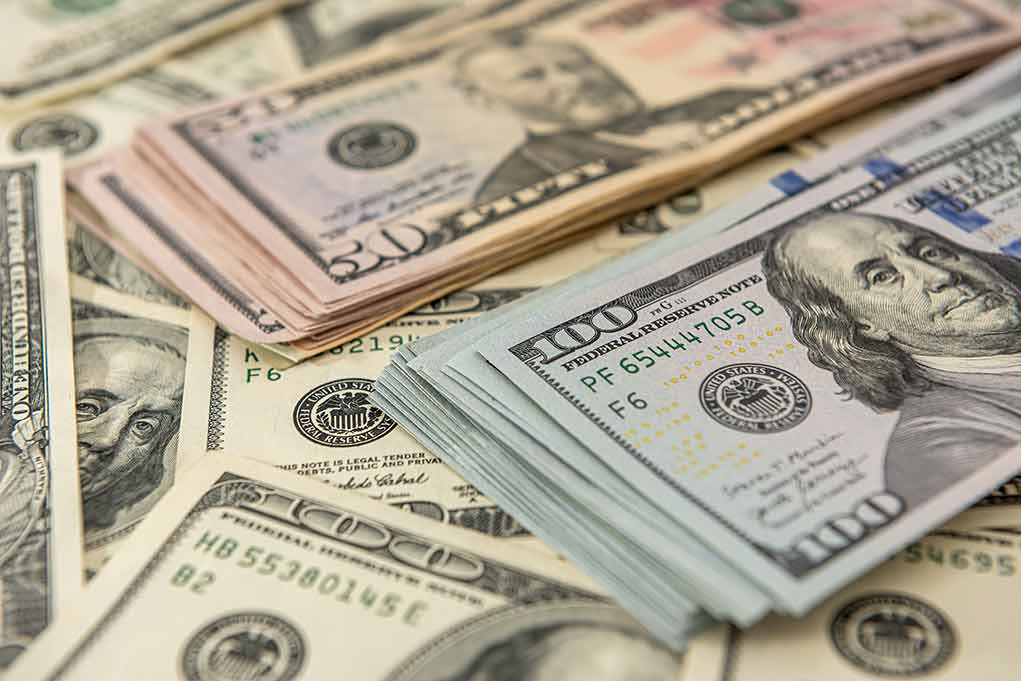 1936085086 featured image Stacks of various U.S. dollar bills.