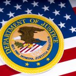Nomination Hearing Sparks Debate on FBI and DOJ Reform Needs Department of Justice emblem on the American flag.