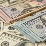 California’s Strategic $50 Million Initiative Against Federal Overreach Unveiled Stacks of various U.S. dollar bills.