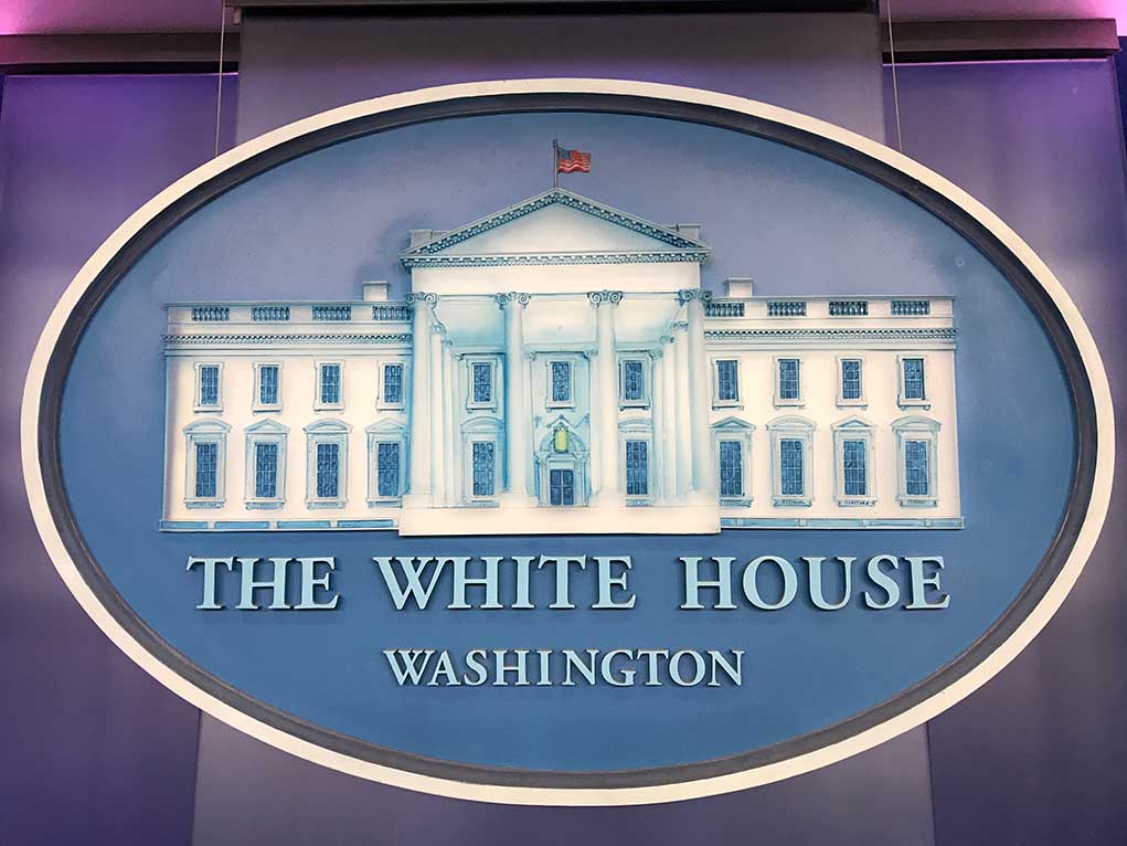 1269797095 featured image The White House emblem with blue background.