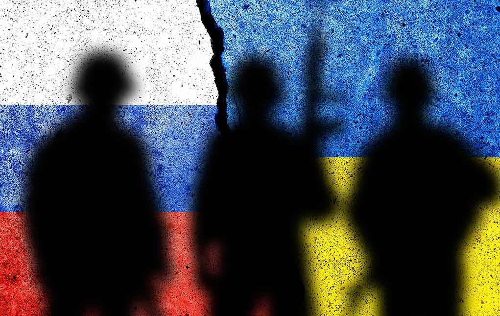 2095910923 featured image Silhouettes against Russian and Ukrainian flag background crack
