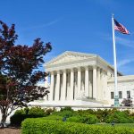 Draft Executive Order Seeks Major Overhaul of U.S. State Department Policies US Supreme Court building with American flag flying