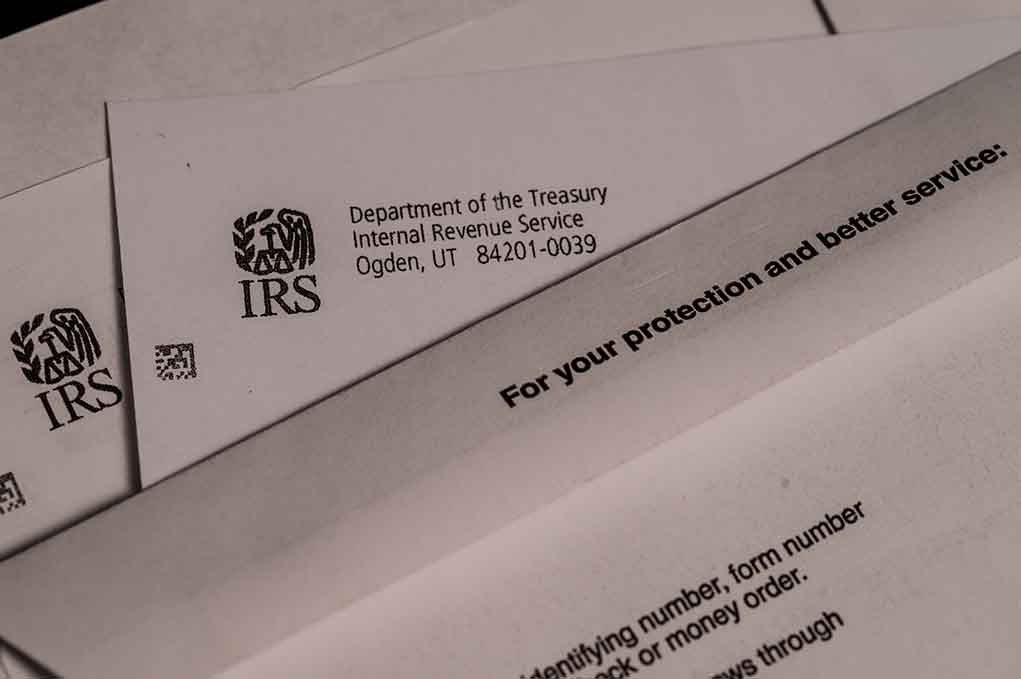 1667446465 featured image IRS letters and envelopes on a table.