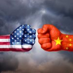 Shenzhen’s E-Commerce Struggles: How U.S. Tariffs Disrupt Chip Market USA and China flags on clenched fists facing off
