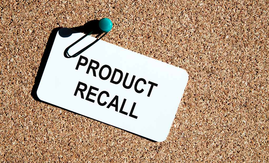 Product recall notice on a corkboard