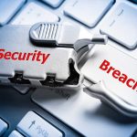Silver lock labeled Security on keyboard Breach key