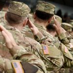 Trump Cracks Down—Military Told to Flag Dysphoria Soldiers in camouflage uniforms saluting in formation outdoors