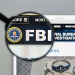 "FBI website shown through magnifying glass."