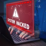 CYBER MELTDOWN: Millions in Damages Warning sign System Hacked on laptop screen