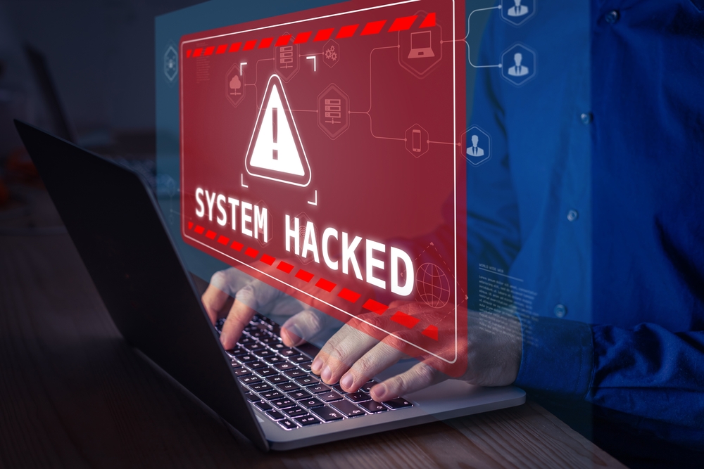 2100631906 featured image Warning sign System Hacked on laptop screen