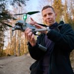 Pentagon’s Drone Bottleneck CRUSHED By New Order Person holding a drone in a forest