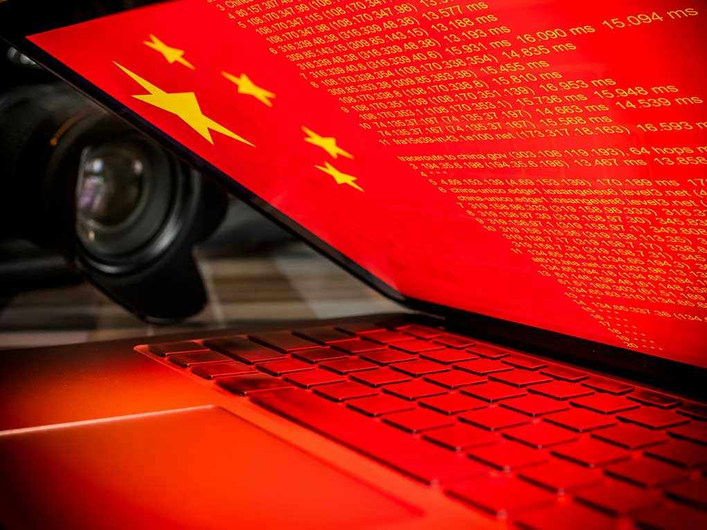 Laptop screen displaying Chinese flag and code