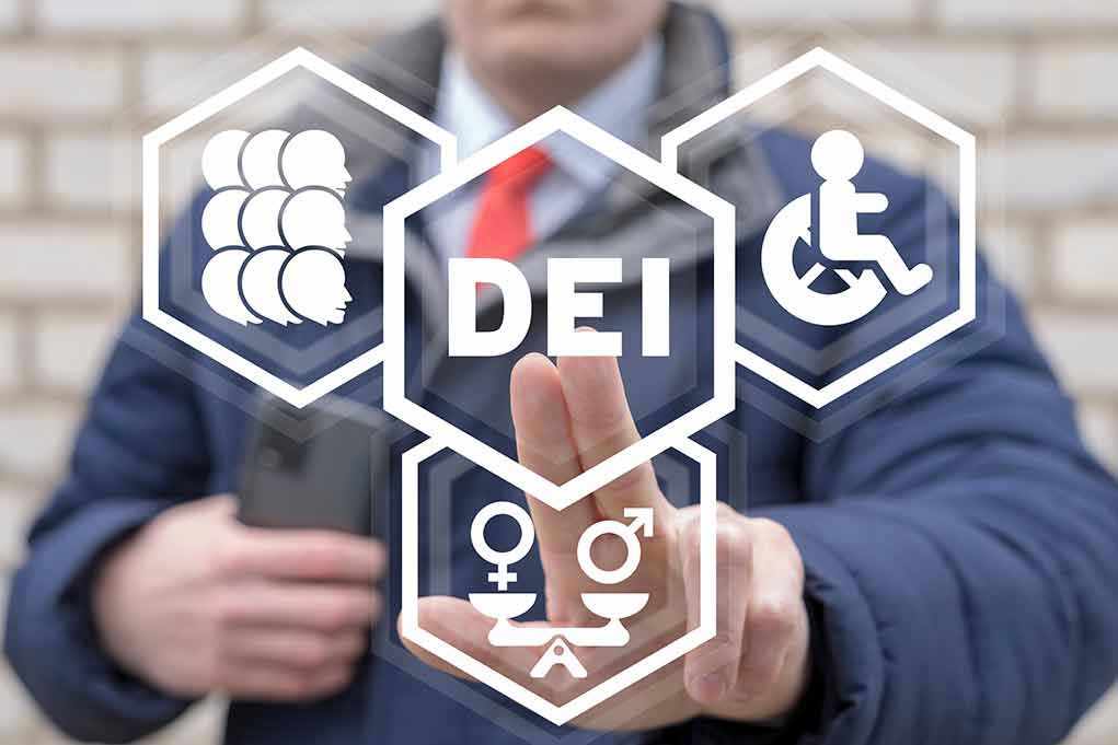 Person pointing at DEI symbols on glass