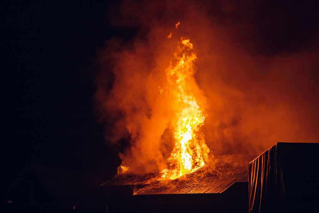 2157190917 Building engulfed in large flames at night