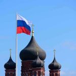 Russian BRICS Plan: Could It Undermine US Tech? Russian flag next to church domes