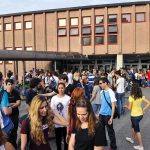 Court GUTS Parents’ Rights—Stunning Move A large group of students socializing outside a school building