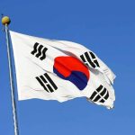 Tariff Bombshell: Trump TRAPS South Korea South Korean flag waving against a clear blue sky