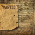 $5 Million Bounty: Notorious Gang Leader TARGETED A vintage wanted poster pinned to a wooden wall