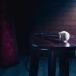 Elder Abuse Scandal Rocks Gospel World! Microphone resting on a stool on stage