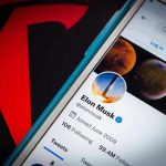 Musk Slams Apple—Rigged Charts? Phone screen showing Twitter profile with spacescapes