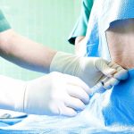 Taxpayers on Hook? Lilly Plan Exposed Healthcare professional administering an injection to a patient in a surgical setting