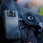 Kamala’s Security Sets Off Police Shuffle — Public Outrage! Body camera attached to a black uniform