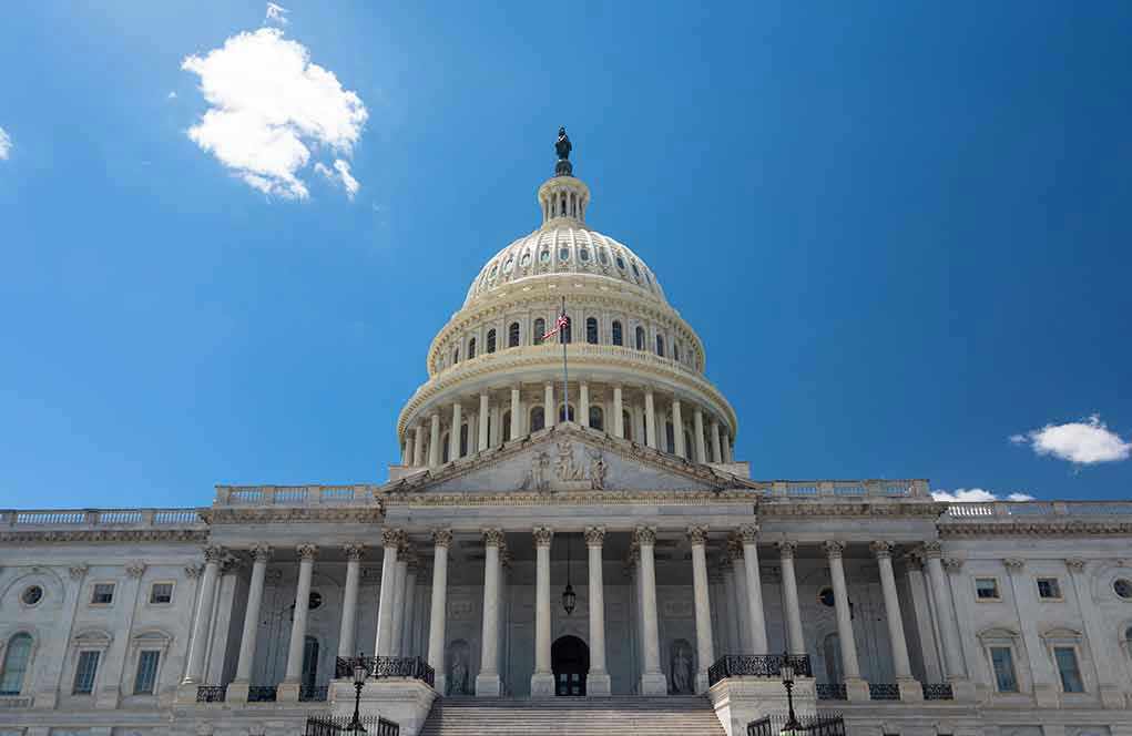 US Capitol building against a clear blue sky