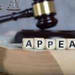Shocking Defamation Ruling: Trump Owes Millions Blocks spelling appeal with gavel and balance scales