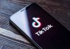 TRUMP FORCES China TikTok Surrender Deal Phone screen showing TikTok logo and app
