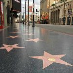 Hollywood COLLAPSE — 30% Jobs VANISHED Hollywood Walk of Fame stars on sidewalk.