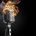 Vintage microphone with flames and smoke