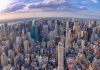 ICE Director UNLEASHES Massive NYC Crackdown Aerial view of city with skyscrapers and cloudy sky