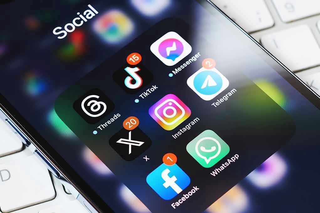 Smartphone showing social media app icons in a folder
