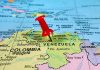 Caribbean Tensions Soar – TRUMP’S Bold Strategy Red pin on Venezuela South America map