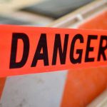 Unbelievable Heist: $3.2 M Vanished in BROAD DAYLIGHT Red tape with the word Danger printed