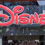 Controversy Hits Disney+: MASSIVE Fallout Bright red Disney logo displayed on a storefront window