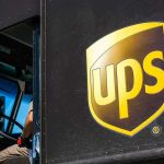 UPS delivery truck with driver inside cab
