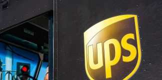 UPS delivery truck with driver inside cab