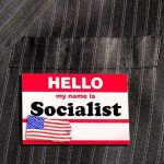 Socialist Surge Shocks Democrats Hello my name is Socialist name tag on suit