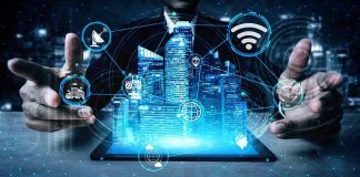 Holographic city above tablet with technology icons.