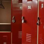 Swalwell’s Dodgy Answers on Locker Room Safety Red lockers with padlocks, one open with hanger.