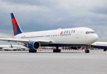 Delta Flight Emergency Exposes HORRIFYING Passenger Behavior Delta Airlines airplane on airport runway cloudy sky