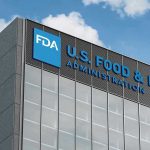 Hallucinogenic Spray TROUBLE—FDA Sparks Outrage FDA building with blue logo and sky background
