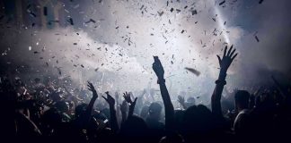 Cognitive EDGE: Are You A Step Above the Rest? Crowd celebrating under confetti and bright lights
