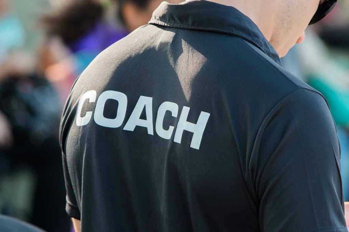 582703915 Person wearing a shirt labeled Coach.