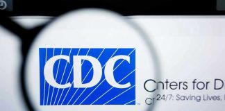 CDC logo magnified on a screen.