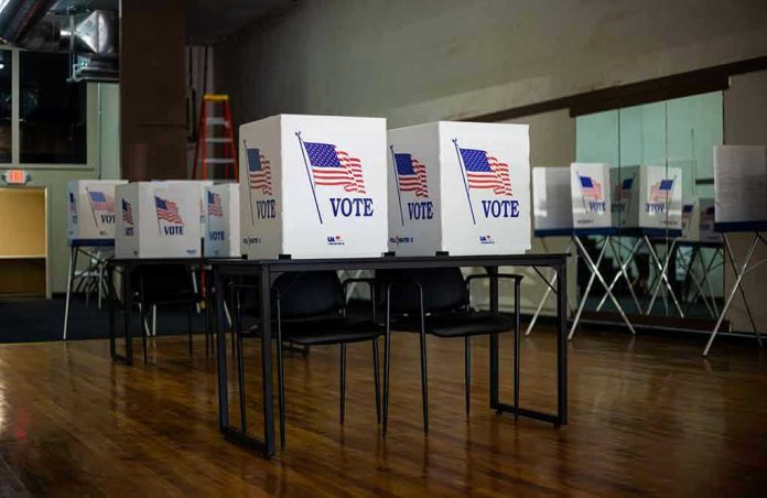 1837302946 Voting booths set up in a room.