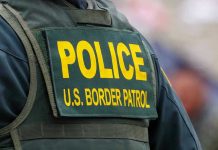 Major US City Told ICE ‘NO’ Police U.S. Border Patrol uniform close-up.